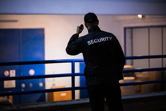 Technician installing security camera